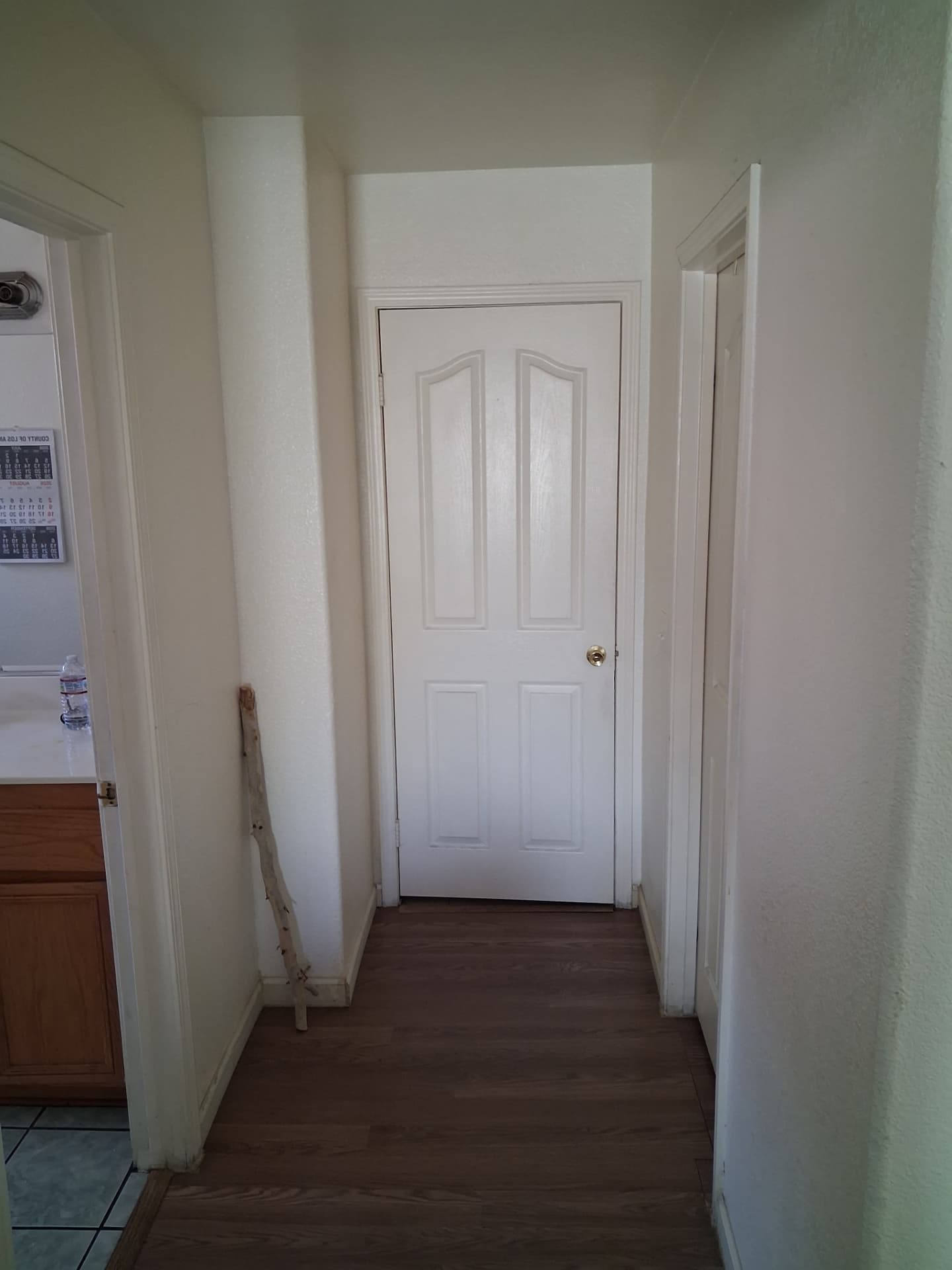 Bright interior hallway with freshly painted white walls and trim